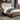 Hutchinson CalKing Bed in Rustic Natural Tone. Diamond tufting can be found all along the fabric upholstered wingback style headboard while the wood grain emphasizes the natural finish.